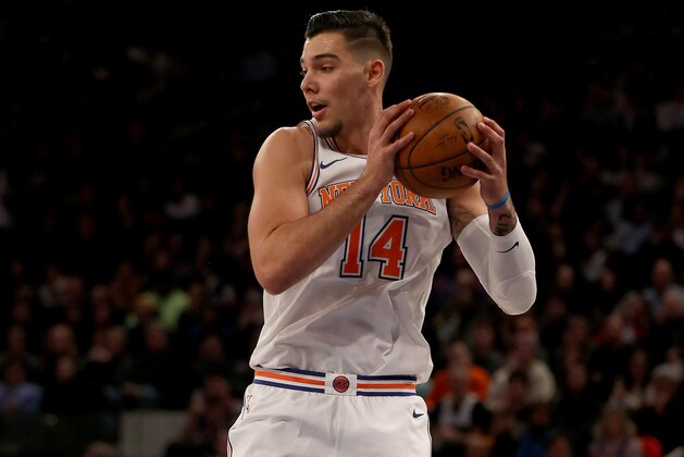 NEW YORK, NEW YORK - JANUARY 02:    Willy Hernangomez #14 of the New York Knicks grabs the rebound in the second half against the San Antonio Spurs at Madison Square Garden on January 02, 2018 in New York City. NOTE TO USER: User expressly acknowledges and agrees that, by downloading and or using this photograph, User is consenting to the terms and conditions of the Getty Images License Agreement.  (Photo by Elsa/Getty Images)