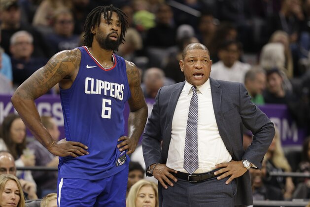 Los Angeles Clippers center DeAndre Jordan, left, talks with head coach Doc Rivers during the first quarter of an NBA basketball game against the Sacramento Kings, Saturday, Nov. 25, 2017, in Sacramento, Calif. (AP Photo/Rich Pedroncelli)