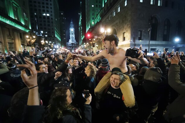 Philadelphia Eagles fans celebrate the team's victory in the NFL Super Bowl 52 between the Philadelphia Eagles and the New England Patriots, Sunday, Feb. 4, 2018, in downtown Philadelphia. (AP Photo/Matt Rourke)