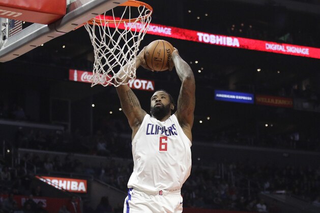 Los Angeles Clippers' DeAndre Jordan goes up for a dunk during the first half of an NBA basketball game against the Toronto Raptors Monday, Dec. 11, 2017, in Los Angeles. (AP Photo/Jae C. Hong)