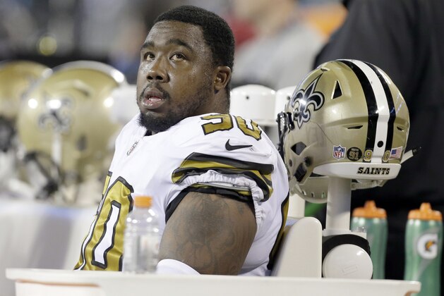 FILE - In this Nov. 17, 2016, file photo, New Orleans Saints' Nick Fairley (90) watches from the bench during the first half of an NFL football game  against the Carolina Panthers in Charlotte, N.C. Saints coach Sean Payton said Thursday, June 8, 2017, that Fairley is seeing multiple heart specialists after one physician advised Fairley to stop playing football. Payton says he hopes Fairley can return to the Saints, but not unless the 29-year-old defensive lineman has “full confidence” that continuing to play won’t worsen a heart condition he’s had throughout his six-year NFL career. (AP Photo/Bob Leverone, File)