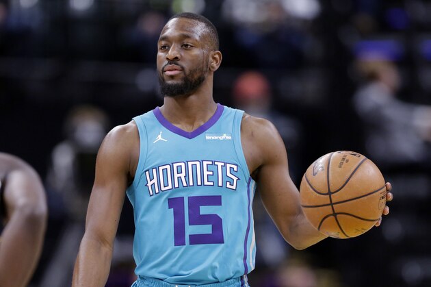 Charlotte Hornets guard Kemba Walker (15) brings the ball up court against the Indiana Pacers during the first half of an NBA basketball game in Indianapolis, Monday, Jan. 29, 2018. (AP Photo/Michael Conroy)