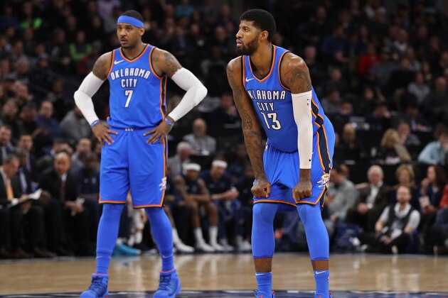 MINNEAPOLIS, MN -  JANUARY 10: Carmelo Anthony #7 and Paul George #13 of the Oklahoma City Thunder stand on the court during the game against the Minnesota Timberwolves on January 10, 2018 at Target Center in Minneapolis, Minnesota. NOTE TO USER: User expressly acknowledges and agrees that, by downloading and or using this Photograph, user is consenting to the terms and conditions of the Getty Images License Agreement. Mandatory Copyright Notice: Copyright 2018 NBAE (Photo by Jordan Johnson/NBAE via Getty Images)