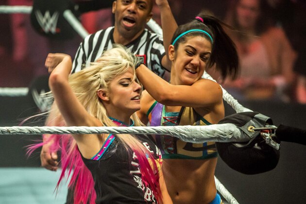 Alexa Bliss (L) and Bayley battle in the ring during the WWE show at Zenith Arena on may 09, 2017 in Lille, France. / AFP PHOTO / PHILIPPE HUGUEN        (Photo credit should read PHILIPPE HUGUEN/AFP/Getty Images)