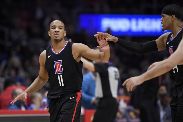 Los Angeles Clippers guard Avery Bradley, left, congratulates forward Tobias Harris after Harris scored during the second half of an NBA basketball game against the Chicago Bulls, Saturday, Feb. 3, 2018, in Los Angeles. The Clippers won 113-103. (AP Photo/Mark J. Terrill)