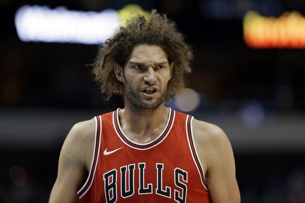 Chicago Bulls' Robin Lopez (42) talks to a teammate on the court during a preseason NBA basketball game against the Dallas Mavericks on Wednesday, Oct. 4, 2017, in Dallas. (AP Photo/Tony Gutierrez)