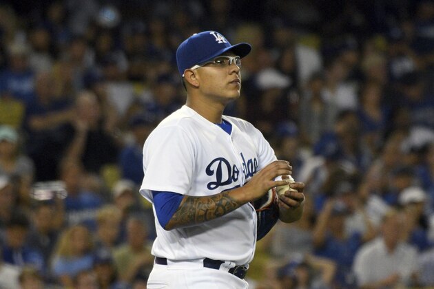 Los Angeles Dodgers' pitcher Julio Urias gathers himself after giving up a two-run double to the Miami Marlins J.T. Riddle in the third inning of a baseball game in Los Angeles, Saturday, May 20, 2017. (AP Photo/Michael Owen Baker)