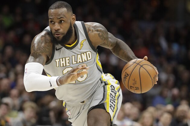 Cleveland Cavaliers' LeBron James drives against the Houston Rockets in the first half of an NBA basketball game, Saturday, Feb. 3, 2018, in Cleveland. (AP Photo/Tony Dejak)