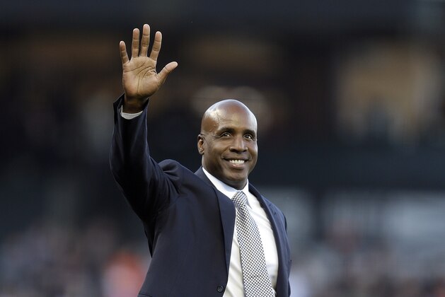 Former San Francisco Giants player Barry Bonds waves to fans before throwing the ceremonial first pitch prior to the Giants' baseball game against the Miami Marlins on Saturday, July 8, 2017, in San Francisco. (AP Photo/Ben Margot)