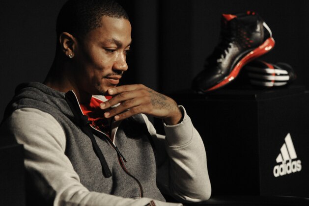 Chicago Bulls player Derrick Rose looks on while unveiling his new shoe the Adidas D Rose 3 during a press conference in Chicago, Thursday, Sept. 13, 2012. (AP Photo/Paul Beaty)