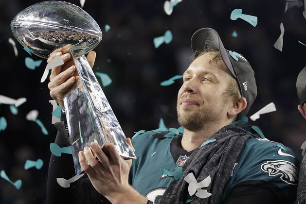 Philadelphia Eagles' Nick Foles holds up the Vince Lombardi Trophy after the NFL Super Bowl 52 football game against the New England Patriots, Sunday, Feb. 4, 2018, in Minneapolis. The Eagles won 41-33. (AP Photo/Matt Slocum)