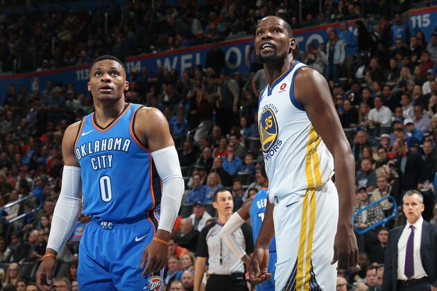 OKLAHOMA CITY, OK - NOVEMBER 22: Kevin Durant #35 of the Golden State Warriors and Russell Westbrook #0 of the Oklahoma City Thunder looks on on November 22, 2017 at Chesapeake Energy Arena in Oklahoma City, Oklahoma. NOTE TO USER: User expressly acknowledges and agrees that, by downloading and or using this photograph, User is consenting to the terms and conditions of the Getty Images License Agreement. Mandatory Copyright Notice: Copyright 2017 NBAE (Photo by Layne Murdoch/NBAE via Getty Images)