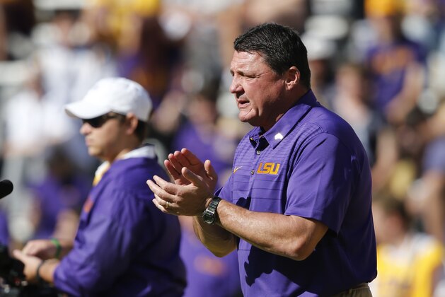 LSU head coach Ed Orgeron walks on the field before an NCAA college football game against Arkansas in Baton Rouge, La., Saturday, Nov. 11, 2017. (AP Photo/Gerald Herbert)
