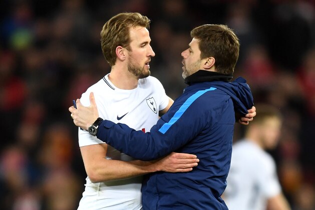 LIVERPOOL, ENGLAND - FEBRUARY 04:  Harry Kane of Tottenham Hotspur and Mauricio Pochettino, Manager of Tottenham Hotspur celebrate vicotry after the Premier League match between Liverpool and Tottenham Hotspur at Anfield on February 4, 2018 in Liverpool, England.  (Photo by Michael Regan/Getty Images)