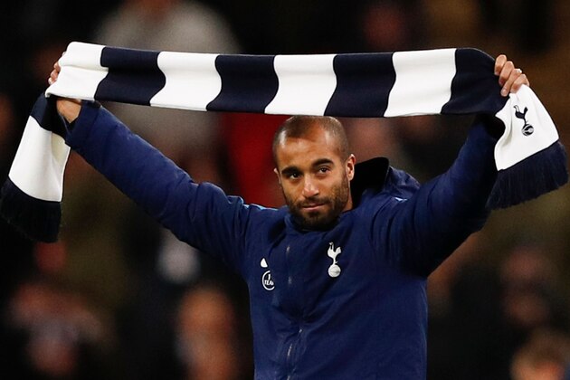 Tottenham Hotspur's new Brazil midfielder Lucas Moura gestures to fans on the pitch at half-time during the English Premier League football match between Tottenham Hotspur and Manchester United at Wembley Stadium in London, on January 31, 2018. / AFP PHOTO / Adrian DENNIS / RESTRICTED TO EDITORIAL USE. No use with unauthorized audio, video, data, fixture lists, club/league logos or 'live' services. Online in-match use limited to 75 images, no video emulation. No use in betting, games or single club/league/player publications.  /         (Photo credit should read ADRIAN DENNIS/AFP/Getty Images)
