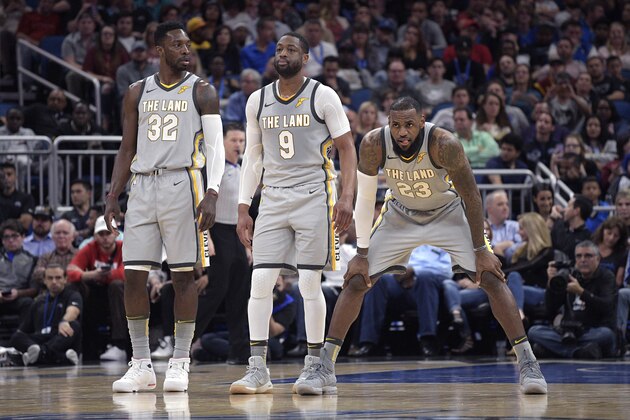 Cleveland Cavaliers forward Jeff Green (32), guard Dwyane Wade (9) and forward LeBron James wait for a play during the first half of an NBA basketball game against the Orlando Magic Tuesday, Feb. 6, 2018, in Orlando, Fla. (AP Photo/Phelan M. Ebenhack)