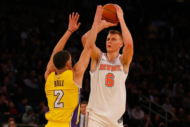 NEW YORK, NY - DECEMBER 12:  (NEW YORK DAILIES OUT)    Kristaps Porzingis #6 of the New York Knicks in action against Lonzo Ball #2 of the Los Angeles Lakers at Madison Square Garden on December 12, 2017 in New York City. The Knicks defeated the Lakers 113-109 in overtime. NOTE TO USER: User expressly acknowledges and agrees that, by downloading and/or using this Photograph, user is consenting to the terms and conditions of the Getty Images License Agreement.  (Photo by Jim McIsaac/Getty Images)