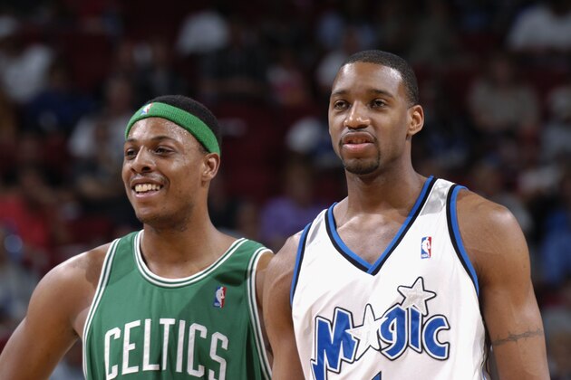 ORLANDO, FL - APRIL 12:  Paul Pierce #34 of the Boston Celtics stands next to Tracy McGrady #1 of the Orlando Magic during the NBA game at TD Waterhouse Centre on April 12, 2003 in Orlando, Florida.  The Magic won 89-86.  NOTE TO USER:  User expressly acknowledges and agrees that, by downloading and or using this Photograph, User is consenting to the terms and conditions of the Getty Images License Agreement.  Mandatory Copyright Notice:  Copyright 2003 NBAE  (Photo by Fernando Medina/NBAE via Getty Images)