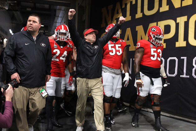 ATLANTA, GA - JANUARY 08: Head coach Kirby Smart of the Georgia Bulldogs walks out of the tunnel with his players during warm ups prior to the game against the Alabama Crimson Tide in the CFP National Championship presented by AT&T at Mercedes-Benz Stadium on January 8, 2018 in Atlanta, Georgia.  (Photo by Christian Petersen/Getty Images)