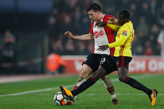Watford's French midfielder Abdoulaye Doucoure (R) vies with Southampton's Danish midfielder Pierre-Emile Hojbjerg (L) during the English FA Cup fourth round football match between Southampton and Watford at St Mary's Stadium in Southampton, southern England on January 27, 2018. / AFP PHOTO / Adrian DENNIS / RESTRICTED TO EDITORIAL USE. No use with unauthorized audio, video, data, fixture lists, club/league logos or 'live' services. Online in-match use limited to 75 images, no video emulation. No use in betting, games or single club/league/player publications.  /         (Photo credit should read ADRIAN DENNIS/AFP/Getty Images)