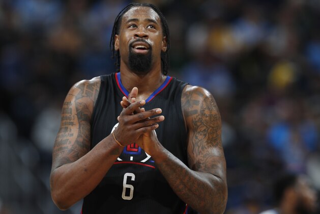 Los Angeles Clippers center DeAndre Jordan applauds after being called for a technical foul against the Denver Nuggets in the second half of an NBA basketball game Saturday, Jan. 21, 2017, in Denver. (AP Photo/David Zalubowski)