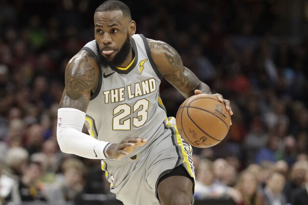 Cleveland Cavaliers' LeBron James drives against the Houston Rockets in the first half of an NBA basketball game, Saturday, Feb. 3, 2018, in Cleveland. (AP Photo/Tony Dejak)