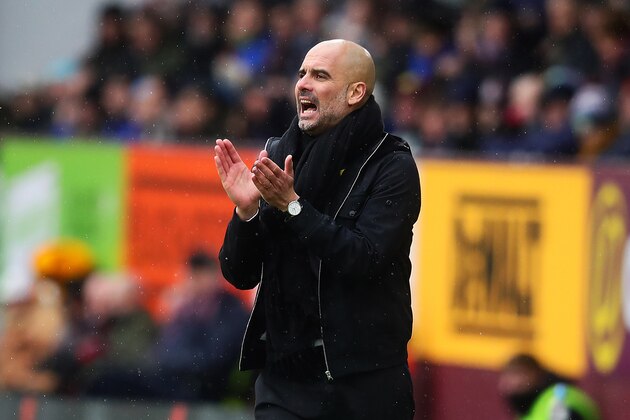 BURNLEY, ENGLAND - FEBRUARY 03: Manchester City manager Josep Guardiola applauds from the touchline during the Premier League match between Burnley and Manchester City at Turf Moor on February 3, 2018 in Burnley, England. (Photo by Chris Brunskill Ltd/Getty Images)
