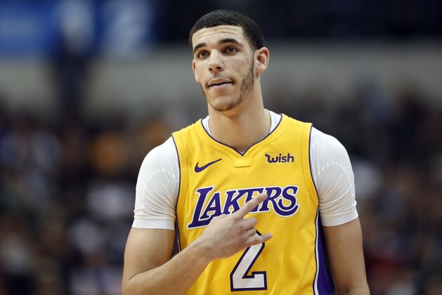 Los Angeles Lakers guard Lonzo Ball (2) signals to a teammate during an offensive possession against the Dallas Mavericks in the first half of an NBA basketball game, Saturday, Jan. 13, 2018, in Dallas. (AP Photo/Tony Gutierrez)