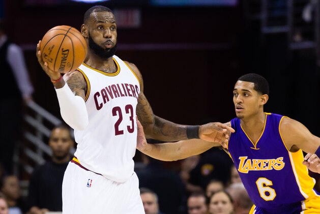 CLEVELAND, OH - DECEMBER 17: LeBron James #23 of the Cleveland Cavaliers passes while under pressure from Jordan Clarkson #6 of the Los Angeles Lakers during the first half at Quicken Loans Arena on December 17, 2016 in Cleveland, Ohio. NOTE TO USER: User expressly acknowledges and agrees that, by downloading and/or using this photograph, user is consenting to the terms and conditions of the Getty Images License Agreement. Mandatory copyright notice. (Photo by Jason Miller/Getty Images)
