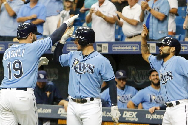 ST. PETERSBURG, FL - OCTOBER 1: Curt Casali #19 of the Tampa Bay Rays celebrates his home run with teammates Daniel Robertson #29 and Curt Casali #54 during the fifth inning of the game against the Baltimore Orioles at Tropicana Field on October 1, 2017 in St. Petersburg, Florida. (Photo by Joseph Garnett Jr./Getty Images)