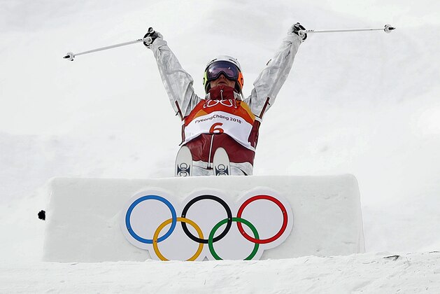 Justine Dufour-Lapointe, of Canada, jumps during the women's moguls qualifying at the 2018 Winter Olympics in Pyeongchang, South Korea, Friday, Feb. 9, 2018. (AP Photo/Gregory Bull)