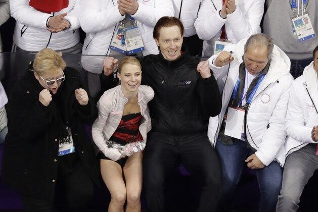 Evgenia Tarasova and Vladimir Morozov, of Russia, reacts after performing in the pair skating short program team event at the 2018 Winter Olympics in Gangneung, South Korea, Friday, Feb. 9, 2018. (AP Photo/Morry Gash)