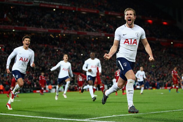 LIVERPOOL, ENGLAND - FEBRUARY 04:  Harry Kane of Tottenham Hotspur celebrates with team mates after scoring his sides second goal and his 100th Premier League goal  during the Premier League match between Liverpool and Tottenham Hotspur at Anfield on February 4, 2018 in Liverpool, England.  (Photo by Clive Brunskill/Getty Images)