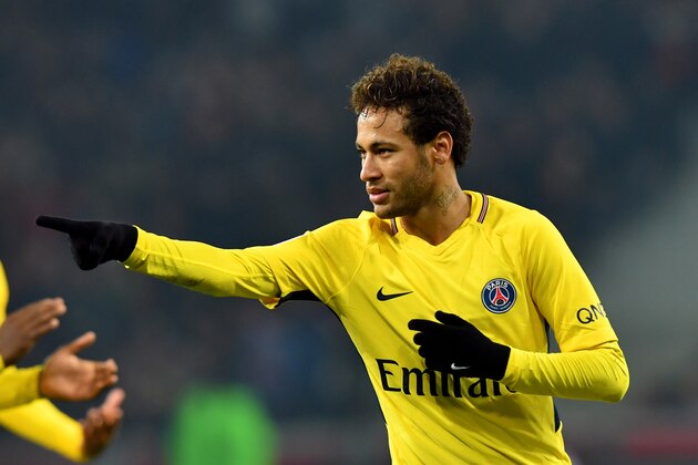 Paris Saint-Germain's Brazilian forward Neymar celebrates after scoring a goal during French L1 football match between Lille Losc and Paris Saint-Germain (PSG), at the Pierre-Mauroy stadium, in Villeneuve-d'Ascq, on February 3, 2018. / AFP PHOTO / DENIS CHARLET        (Photo credit should read DENIS CHARLET/AFP/Getty Images)
