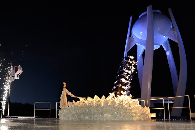 PYEONGCHANG-GUN, SOUTH KOREA - FEBRUARY 09:  Kim Yu-na, South Korean Figure Skater lights the cauldron during the Opening Ceremony of the PyeongChang 2018 Winter Olympic Games at PyeongChang Olympic Stadium on February 9, 2018 in Pyeongchang-gun, South Korea.  (Photo by Pool - David J. Phillip/Getty Images)