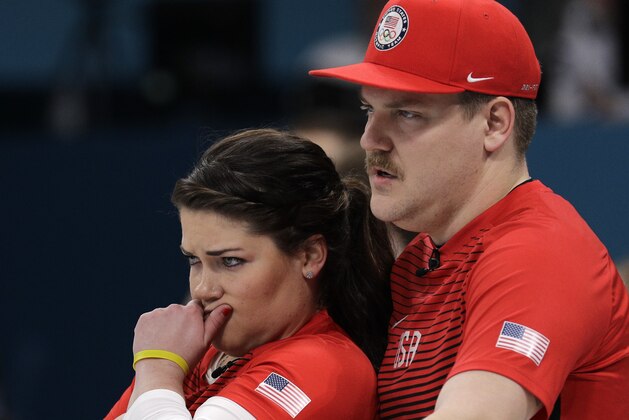 United States' siblings Matt and Becca Hamilton huddle to discuss their strategy during their mixed doubles curling match against Switzerland at the 2018 Winter Olympics in Gangneung, South Korea, Friday, Feb. 9, 2018. (AP Photo/Aaron Favila)