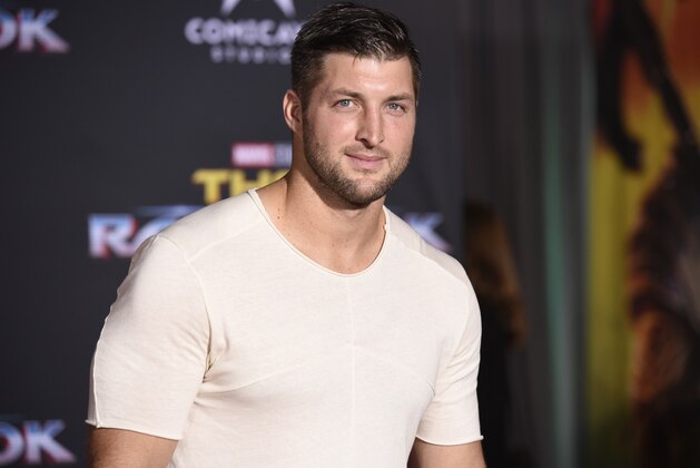 Tim Tebow arrives at the world premiere of