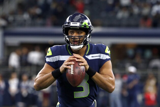 Seattle Seahawks quarterback Russell Wilson (3) warms up before an NFL football game against the Dallas Cowboys on Sunday, Dec. 24, 2017, in Arlington, Texas. (AP Photo/Michael Ainsworth)