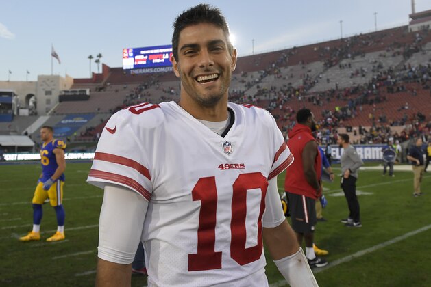 San Francisco 49ers quarterback Jimmy Garoppolo smiles as he walks off the field after their 34-13 win against the Los Angeles Rams during the second half of an NFL football game Sunday, Dec. 31, 2017, in Los Angeles. (AP Photo/Mark J. Terrill)