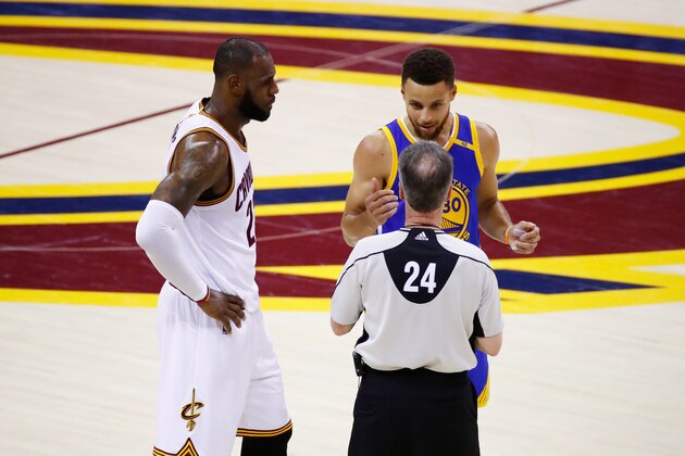 CLEVELAND, OH - JUNE 09: LeBron James #23 of the Cleveland Cavaliers and Stephen Curry #30 of the Golden State Warriors discuss the call with referee Mike Callahan #24 during the first half in Game 4 of the 2017 NBA Finals at Quicken Loans Arena on June 9, 2017 in Cleveland, Ohio. NOTE TO USER: User expressly acknowledges and agrees that, by downloading and or using this photograph, User is consenting to the terms and conditions of the Getty Images License Agreement.  (Photo by Gregory Shamus/Getty Images)