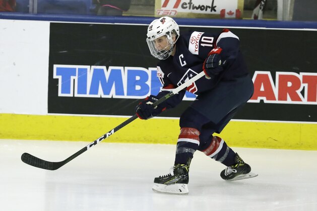 United States forward Meghan Duggan passes during the first period of the gold-medal game of the women's world hockey championships, Friday, April 7, 2017, in Plymouth, Mich. (AP Photo/Carlos Osorio)