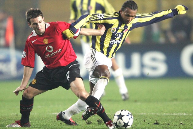 Liam Miller of Manchester United, left, fights for the ball with Fenerbahce's Marco Aurelio at the Sukru Saracoglu Stadium in Istanbul, Turkey, Wednesday Dec. 8, 2004, during their Champions League Group D soccer match. (AP Photo/Str)