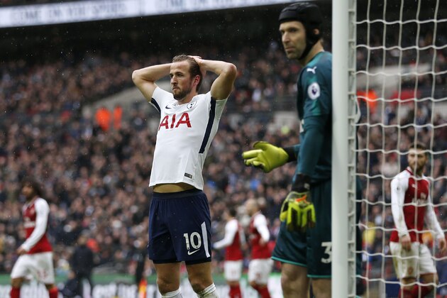 Tottenham Hotspur's English striker Harry Kane reacts after missing a chance during the English Premier League football match between Tottenham Hotspur and Arsenal at Wembley Stadium in London, on February 10, 2018. / AFP PHOTO / IKIMAGES / Ian KINGTON / RESTRICTED TO EDITORIAL USE. No use with unauthorized audio, video, data, fixture lists, club/league logos or 'live' services. Online in-match use limited to 45 images, no video emulation. No use in betting, games or single club/league/player publications.  /         (Photo credit should read IAN KINGTON/AFP/Getty Images)