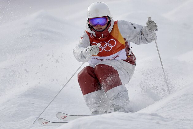 Audrey Robichaud, of Canada, runs the course during the women's moguls qualifying at the 2018 Winter Olympics in Pyeongchang, South Korea, Friday, Feb. 9, 2018. (AP Photo/Kin Cheung)