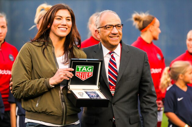 SAN DIEGO, CA - JANUARY 21:  Hope Solo is presented with commemorative items honoring her 200th cap by U.S. Soccer Vice President Carlos Cordeiro the field during pregame ceremonies prior to the first half against the Danish women's national team at SDCCU Stadium on January 21, 2018 in San Diego, California.  (Photo by Kent Horner/Getty Images)