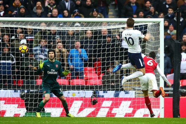 LONDON, ENGLAND - FEBRUARY 10: Harry Kane of Tottenham Hotspur heads the opening goal during the Premier League match between Tottenham Hotspur and Arsenal at Wembley Stadium on February 10, 2018 in London, England. (Photo by Chris Brunskill Ltd/Getty Images)