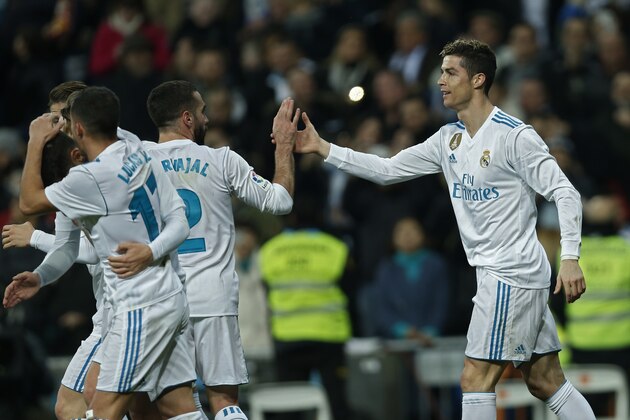 Real Madrid's Cristiano Ronaldo, right, celebrates with teammates after scoring his side's fourth goal during a Spanish La Liga soccer match between Real Madrid and Real Sociedad at the Santiago Bernabeu stadium in Madrid, Saturday, Feb. 10, 2018. (AP Photo/Francisco Seco) Real Madrid's Cristiano Ronaldo, right, celebrates with teammates after scoring his side's fourth goal during a Spanish La Liga soccer match between Real Madrid and Real Sociedad at the Santiago Bernabeu stadium in Madrid, Saturday, Feb. 10, 2018. (AP Photo/Francisco Seco)