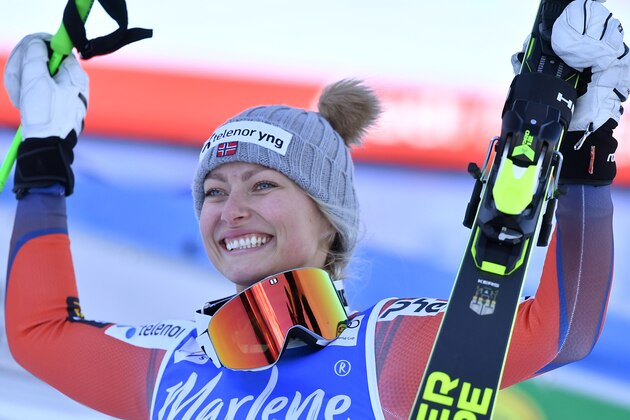 Norway's Ragnhild Mowinckel, second, celebrates during the podium ceremony of the FIS Alpine World Cup Women's Giant Slalom on January 23, 2018 in Kronplatz / Plan de Corones, Italian Alps. 
Germany's Viktoria Rebensburg won the race ahead of Norway's Ragnhild Mowinckel, and Italy's Federica Brignone. / AFP PHOTO / Tiziana FABI        (Photo credit should read TIZIANA FABI/AFP/Getty Images)