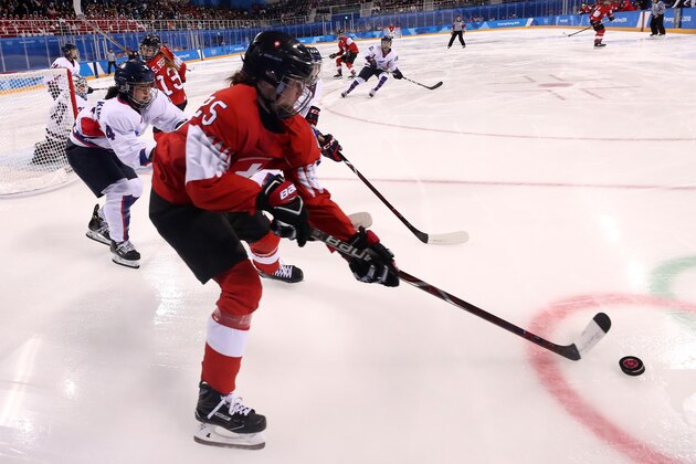 GANGNEUNG, SOUTH KOREA - FEBRUARY 10:  Alina Muller #25 of Switzerland controls the puck against Korea during the Women's Ice Hockey Preliminary Round - Group B game on day one of the PyeongChang 2018 Winter Olympic Games at Kwandong Hockey Centre on February 10, 2018 in Gangneung, South Korea.  (Photo by Ronald Martinez/Getty Images)
