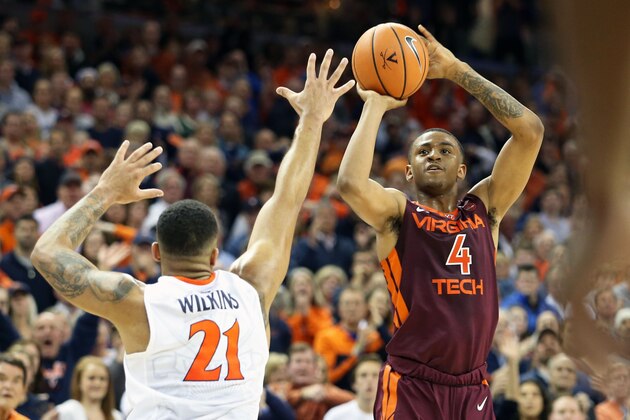 CHARLOTTESVILLE, VA - FEBRUARY 10: Nickeil Alexander-Walker #4 of the Virginia Tech Hokies shoots over Isaiah Wilkins #21 of the Virginia Cavaliers in the first half during a game at John Paul Jones Arena on February 10, 2018 in Charlottesville, Virginia. (Photo by Ryan M. Kelly/Getty Images)